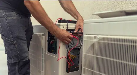 Plumber fixing bathroom faucet.
